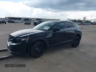 2024 Mazda CX-30 S Select Sport with VIN 3MVDMBBM3RM700797, listed as a IAAI auction lot 42686898 with 23,170 mi miles and . Bid and sale history available at DreamBid. Image 2.