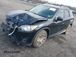 2016 Mazda CX-5 Touring with VIN JM3KE4CY7G0602267, listed as a IAAI auction lot 41854213 with 134,170 mi miles and . Bid and sale history available at carsss.com. Image 17.