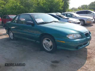 1996 Pontiac Grand Am z VIN 1G2NW12M6TC782385, wystawiony jako IAAI lot #42382005 z przebiegiem 119 751 mil mil oraz . Historia ofert i sprzedaży dostępna na DreamBid. Obrazek 1.