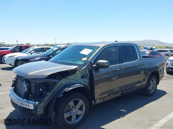 2022 Honda Ridgeline RTL with VIN 5FPYK3F58NB007618, listed as a IAAI auction lot 42258443 with 14,036 mi miles and . Bid and sale history available at DreamBid. Image 2.