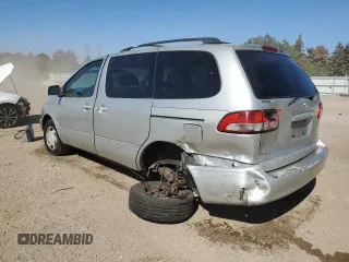 2002 Toyota Sienna LE with VIN 4T3ZF13C52U504138, listed as a Copart auction lot 74633984 with 154,406 mi miles and Salvage Title. Bid and sale history available at carsss.com. Image 2.