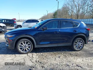 2021 Mazda CX-5 Grand Touring with VIN JM3KFADM5M0428279, listed as a IAAI auction lot 41747175 with 49,579 mi miles. Bid and sale history available at carsss.com. Image 15.