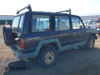 1990 Isuzu Trooper z VIN JACCH58EXL7903060, wystawiony jako IAAI lot #42516100 z przebiegiem 189 700 mil mil oraz . Historia ofert i sprzedaży dostępna na DreamBid. Obrazek 4.