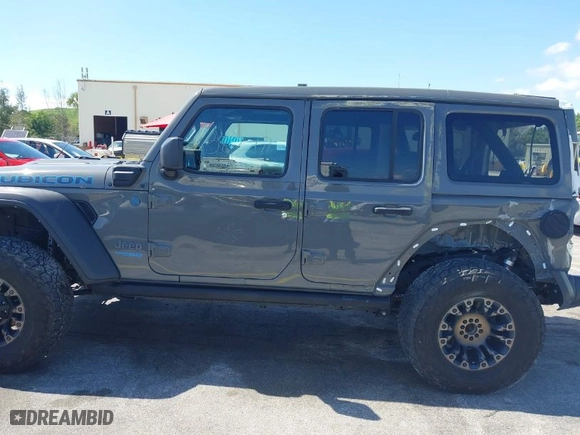 2022 Jeep Wrangler 4xe Unlimited Rubicon with VIN 1C4JJXR62NW189370, listed as a IAAI auction lot 42043547 with 38,277 mi miles. Bid and sale history available at carsss.com. Image 14.