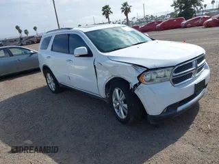 2013 Dodge Durango Crew with VIN 1C4SDHDT2DC679600, listed as a IAAI auction lot 42215737 with 128,499 mi miles and . Bid and sale history available at DreamBid. Image 1.