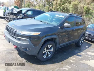 2014 Jeep Cherokee Trailhawk with VIN 1C4PJMBB6EW162303, listed as a IAAI auction lot 41910167 with 133,669 mi miles. Bid and sale history available at carsss.com. Image 18.