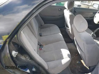 2000 Mazda 626 LX with VIN 1YVGF22CXY5123930, listed as a IAAI auction lot 40712369 with 210,234 mi miles. Bid and sale history available at carsss.com. Image 8.