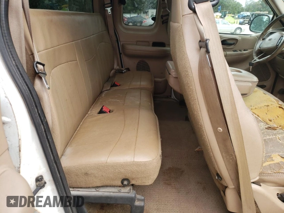 1999 Ford F-150 z VIN 1FTRX07W6XKA48100, wystawiony jako Copart lot #73209844 z przebiegiem Nie podano mil oraz Szkoda całkowita • Salvage title. Historia ofert i sprzedaży dostępna na DreamBid. Obrazek 10.