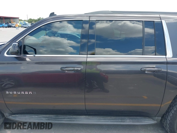 2015 Chevrolet Suburban LT z VIN 1GNSKJKC9FR245097, wystawiony jako IAAI lot #42468168 z przebiegiem 198 454 mil mil oraz . Historia ofert i sprzedaży dostępna na DreamBid. Obrazek 14.