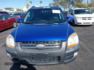 2005 Kia Sportage LX with VIN KNDJF723457057402, listed as a IAAI auction lot 41471742 with 215,565 mi miles and . Bid and sale history available at carsss.com. Image 12.