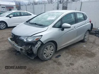 2015 Honda Fit LX with VIN 3HGGK5H57FM784299, listed as a IAAI auction lot 41863989 with 169,657 mi miles. Bid and sale history available at carsss.com. Image 2.