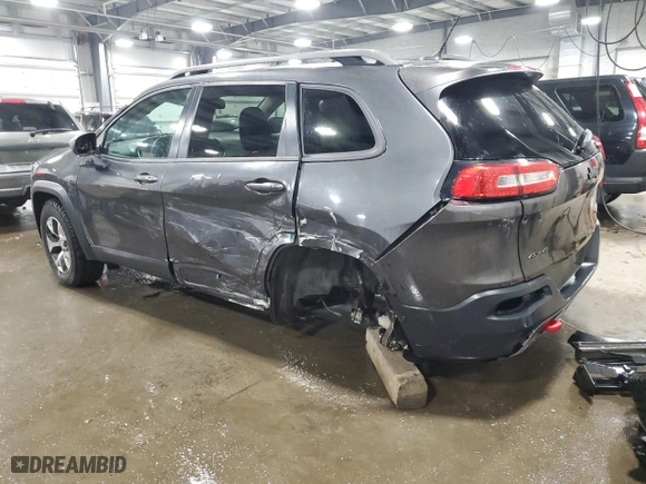 2015 Jeep Cherokee Trailhawk with VIN 1C4PJMBS6FW786085, listed as a Copart auction lot 48791955 with 123,574 mi miles and Salvage Title. Bid and sale history available at carsss.com. Image 2.