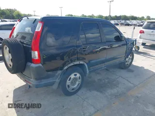 2005 Honda CR-V LX with VIN JHLRD78535C031868, listed as a IAAI auction lot 42002372 with 201,258 mi miles. Bid and sale history available at carsss.com. Image 4.