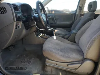 1999 Isuzu Rodeo S with VIN 4S2CK58W2X4336401, listed as a Copart auction lot 83872484 with 191,278 mi miles and Salvage title. Bid and sale history available at DreamBid. Image 7.