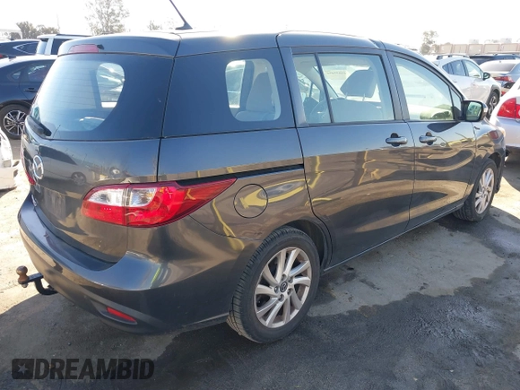 2014 Mazda 5 Sport with VIN JM1CW2BL5E0166522, listed as a IAAI auction lot 41635454 with 94,225 mi miles and . Bid and sale history available at DreamBid. Image 4.