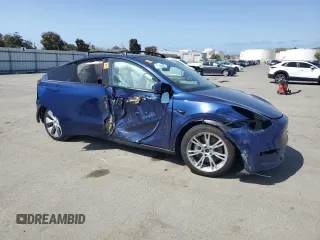 2023 Tesla Model Y Long Range with VIN 7SAYGAEE8PF927092, listed as a Copart auction lot 53917185 with 17,639 mi miles and Salvage Title. Bid and sale history available at DreamBid. Image 4.