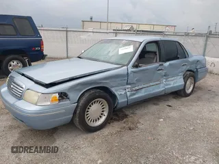 1999 Ford Crown Victoria z VIN 2FAFP73WXXX221069, wystawiony jako IAAI lot #41750127 z przebiegiem 177 142 mil mil oraz . Historia ofert i sprzedaży dostępna na DreamBid. Obrazek 17.