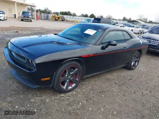 2013 Dodge Challenger R/T with VIN 2C3CDYBT0DH667924, listed as a IAAI auction lot 41278844 with 234,218 mi miles. Bid and sale history available at carsss.com. Image 2.