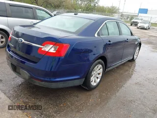 2011 Ford Taurus SE with VIN 1FAHP2DW7BG128857, listed as a IAAI auction lot 41705643 with 163,589 mi miles. Bid and sale history available at carsss.com. Image 4.