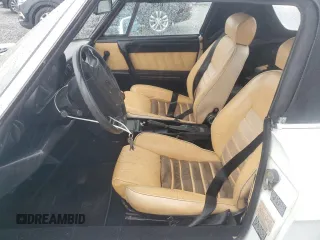 1991 Alfa Romeo Spider z VIN ZARBB32G8M6005213, wystawiony jako Copart lot #74077224 z przebiegiem Nie podano mil oraz Nie do naprawy. Historia ofert i sprzedaży dostępna na DreamBid. Obrazek 7.