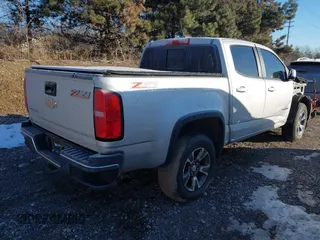 2016 Chevrolet Colorado 4WD Z71 with VIN 1GCGTDE37G1245799, listed as a IAAI auction lot 41408092 with 128,912 mi miles. Bid and sale history available at carsss.com. Image 4.