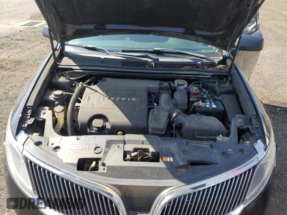 2013 Lincoln MKS z VIN 1LNHL9EK2DG615733, wystawiony jako Copart lot #68223794 z przebiegiem 402 495 mil mil oraz Szkoda całkowita • Salvage title. Historia ofert i sprzedaży dostępna na DreamBid. Obrazek 11.