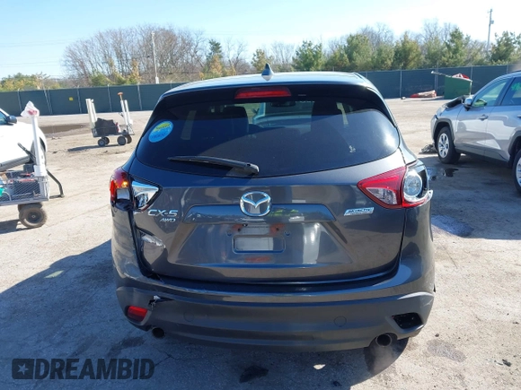 2014 Mazda CX-5 Grand Touring with VIN JM3KE4DY4E0320695, listed as a IAAI auction lot 41989350 with 169,391 mi miles and . Bid and sale history available at DreamBid. Image 17.