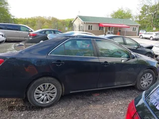 2014 Toyota Camry L with VIN 4T4BF1FK7ER395057, listed as a IAAI auction lot 42215441 with 166,247 mi miles and . Bid and sale history available at DreamBid. Image 14.