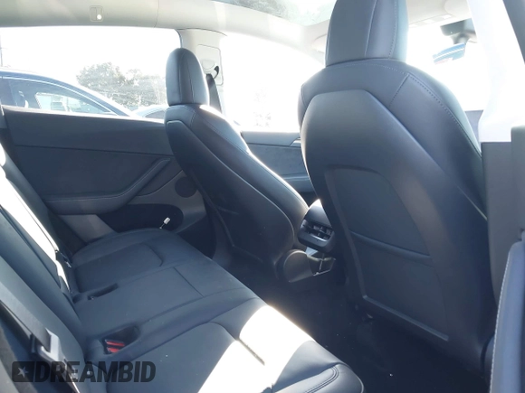 2022 Tesla Model Y Performance with VIN 7SAYGDEF7NF562895, listed as a IAAI auction lot 41692864 with 29,904 mi miles and . Bid and sale history available at DreamBid. Image 8.