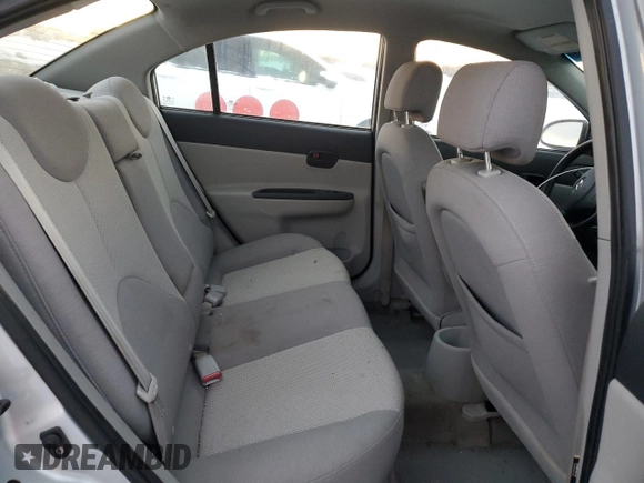 2007 Hyundai Accent GL z VIN KMHCN45CX7U127037, wystawiony jako Copart lot #86041984 z przebiegiem 212 828 mil mil oraz Szkoda całkowita • Salvage title. Historia ofert i sprzedaży dostępna na DreamBid. Obrazek 10.