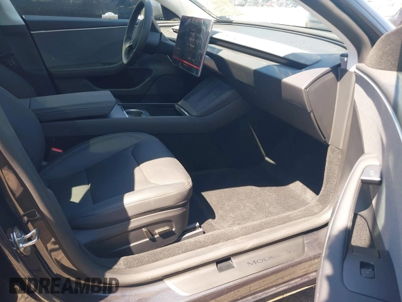 2024 Tesla Model 3 with VIN 5YJ3E1EA7RF863382, listed as a IAAI auction lot 41780246 with 1,294 mi miles and . Bid and sale history available at DreamBid. Image 5.