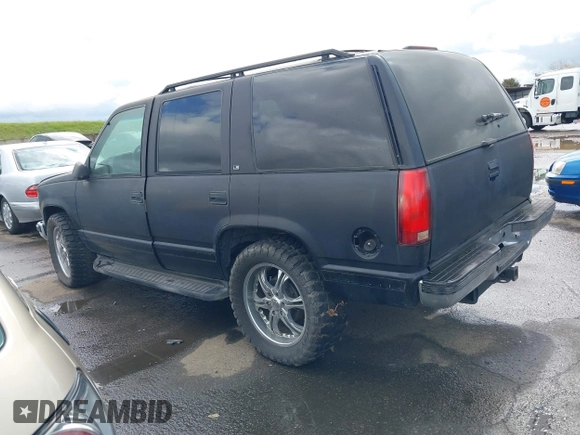 1999 Chevrolet Tahoe Z71 with VIN 1GNEK13R1XJ425996, listed as a IAAI auction lot 41798943 with 203,106 mi miles and . Bid and sale history available at DreamBid. Image 3.