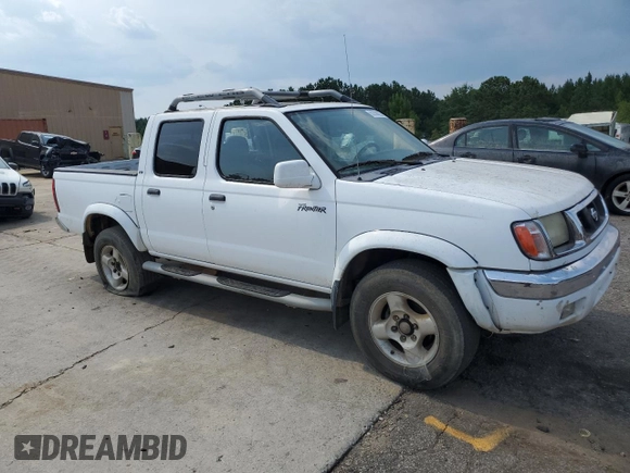 2000 Nissan Frontier XE with VIN 1N6ED27T1YC385792, listed as a Copart auction lot 62268225 with 291,906 mi miles and Salvage title. Bid and sale history available at DreamBid. Image 4.