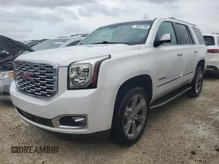 2019 GMC Yukon Denali with VIN 1GKS1CKJ0KR395653, listed as a Copart auction lot 79501764 with 0 mi miles and Salvage Title. Bid and sale history available at carsss.com. Image 1.