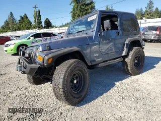 2002 Jeep Wrangler Sport z VIN 1J4FA49S22P735571, wystawiony jako Copart lot #59596175 z przebiegiem 121 887 mil mil oraz Szkoda całkowita • Salvage title. Historia ofert i sprzedaży dostępna na DreamBid. Obrazek 1.