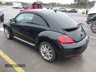 2017 Volkswagen Beetle 1.8T SE with VIN 3VWJ17AT9HM618202, listed as a IAAI auction lot 41562078 with 101,808 mi miles. Bid and sale history available at carsss.com. Image 3.