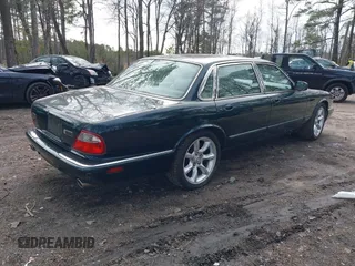 2003 Jaguar XJ with VIN SAJDA15B53MF53212, listed as a IAAI auction lot 41613266 with 180,165 mi miles and . Bid and sale history available at DreamBid. Image 4.