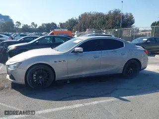 2014 Maserati Ghibli S Q4 with VIN ZAM57RTA8E1095303, listed as a IAAI auction lot 41600587 with 98,215 mi miles. Bid and sale history available at carsss.com. Image 14.