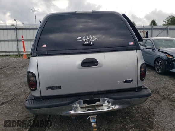 2000 Ford F-150 XL with VIN 2FTRX08L2YCA22507, listed as a Copart auction lot 55390075 with 197,785 mi miles and Salvage title. Bid and sale history available at DreamBid. Image 6.