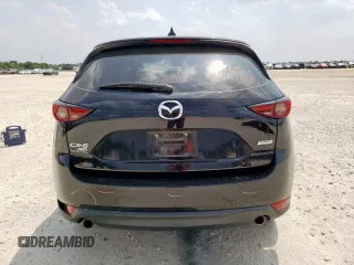 2018 Mazda CX-5 Grand Touring with VIN JM3KFBDM6J0414523, listed as a Copart auction lot 57581145 with 69,353 mi miles and Salvage title. Bid and sale history available at DreamBid. Image 6.