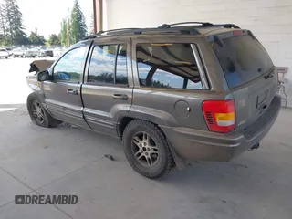 1999 Jeep Grand Cherokee Limited z VIN 1J4GW68N0XC512229, wystawiony jako IAAI lot #42189815 z przebiegiem 230 028 mil mil oraz . Historia ofert i sprzedaży dostępna na DreamBid. Obrazek 3.