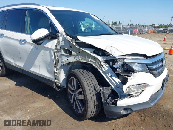2018 Honda Pilot Touring with VIN 5FNYF6H95JB019122, listed as a IAAI auction lot 42439283 with 128,848 mi miles and . Bid and sale history available at DreamBid. Image 6.