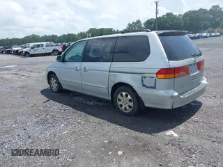 2002 Honda Odyssey EX z VIN 2HKRL18692H526842, wystawiony jako IAAI lot #42495810 z przebiegiem 220 289 mil mil oraz . Historia ofert i sprzedaży dostępna na DreamBid. Obrazek 3.