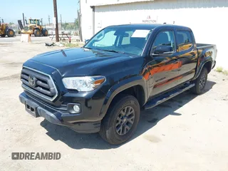 2023 Toyota Tacoma SR with VIN 3TMCZ5AN1PM654572, listed as a IAAI auction lot 42312575 with 14,111 mi miles and . Bid and sale history available at DreamBid. Image 2.