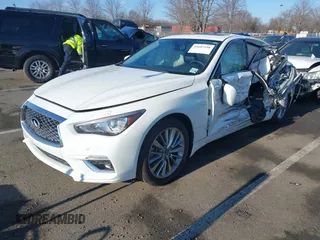 2021 Infiniti Q50 Luxe z VIN JN1EV7BR9MM754818, wystawiony jako IAAI lot #41687198 z przebiegiem 15 985 mil mil oraz . Historia ofert i sprzedaży dostępna na DreamBid. Obrazek 2.