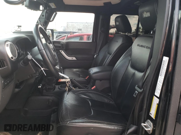 2013 Jeep Wrangler Unlimited Rubicon 10th Anniversary with VIN 1C4HJWFGXDL543660, listed as a Copart auction lot 61462104 with 115,897 mi miles and Salvage title. Bid and sale history available at DreamBid. Image 7.