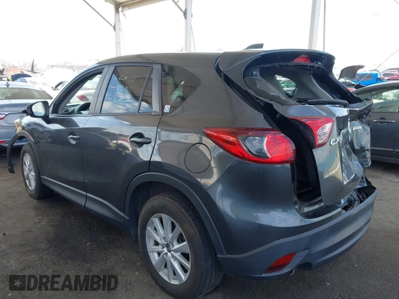 2014 Mazda CX-5 Touring with VIN JM3KE2CY9E0384401, listed as a IAAI auction lot 41699913 with 75,301 mi miles. Bid and sale history available at carsss.com. Image 3.