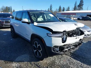 2024 Rivian R1S Adventure with VIN 7PDSGBBA9RN039684, listed as a IAAI auction lot 41558846 with 13,725 mi miles. Bid and sale history available at carsss.com. Image 1.