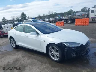 2016 Tesla Model S 90D with VIN 5YJSA1E21GF129964, listed as a IAAI auction lot 41817494 with 88,536 mi miles. Bid and sale history available at carsss.com. Image 1.