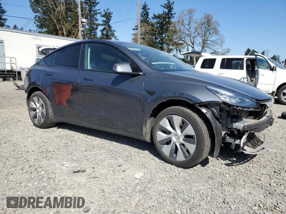 2020 Tesla Model Y Long Range with VIN 5YJYGDEEXLF017789, listed as a Copart auction lot 52705185 with 49,470 mi miles and Salvage Title. Bid and sale history available at DreamBid. Image 4.
